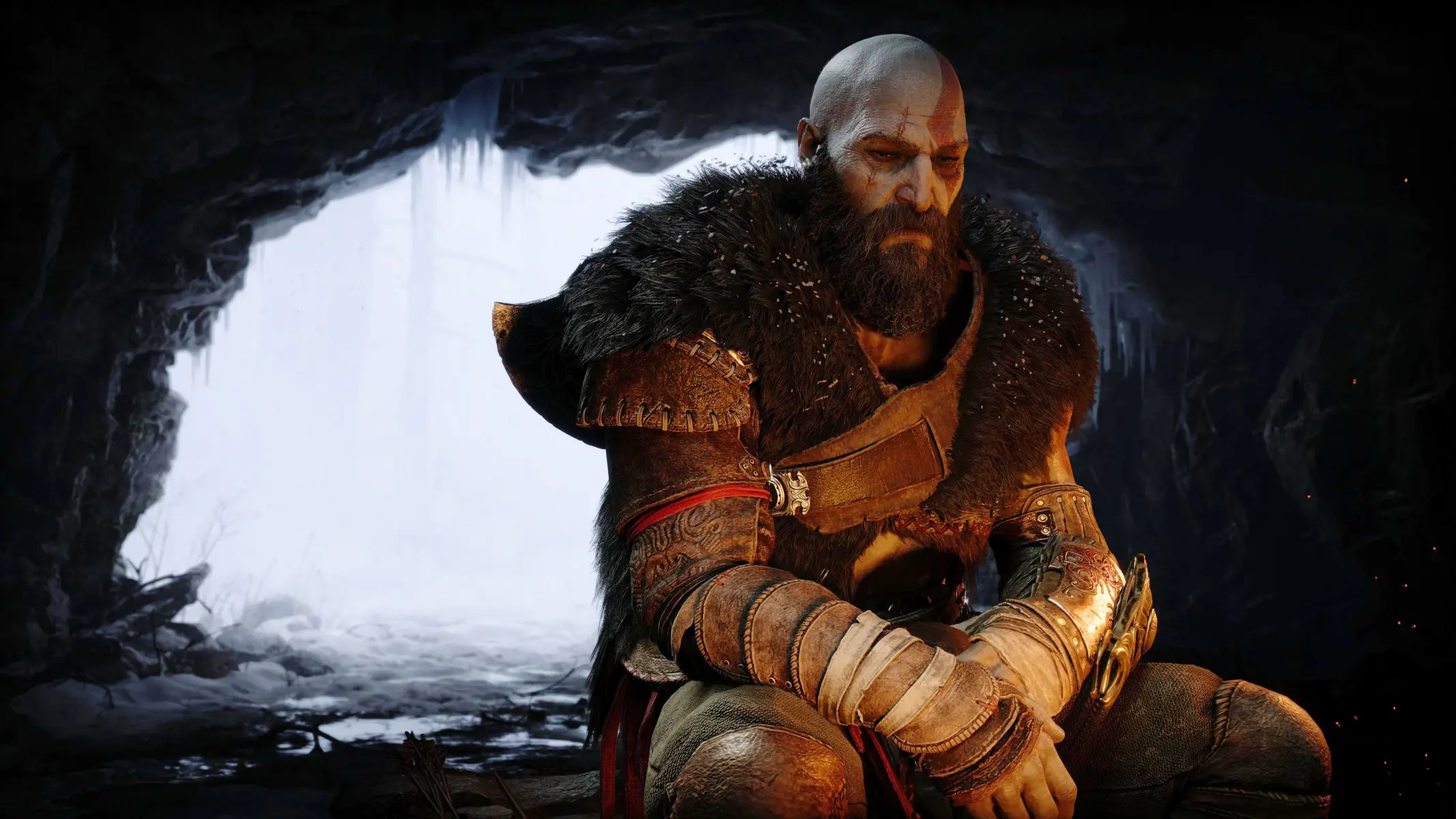 Close-up portrait of Kratos from God of War Ragnarok wearing fur armor, sitting in a snowy cave