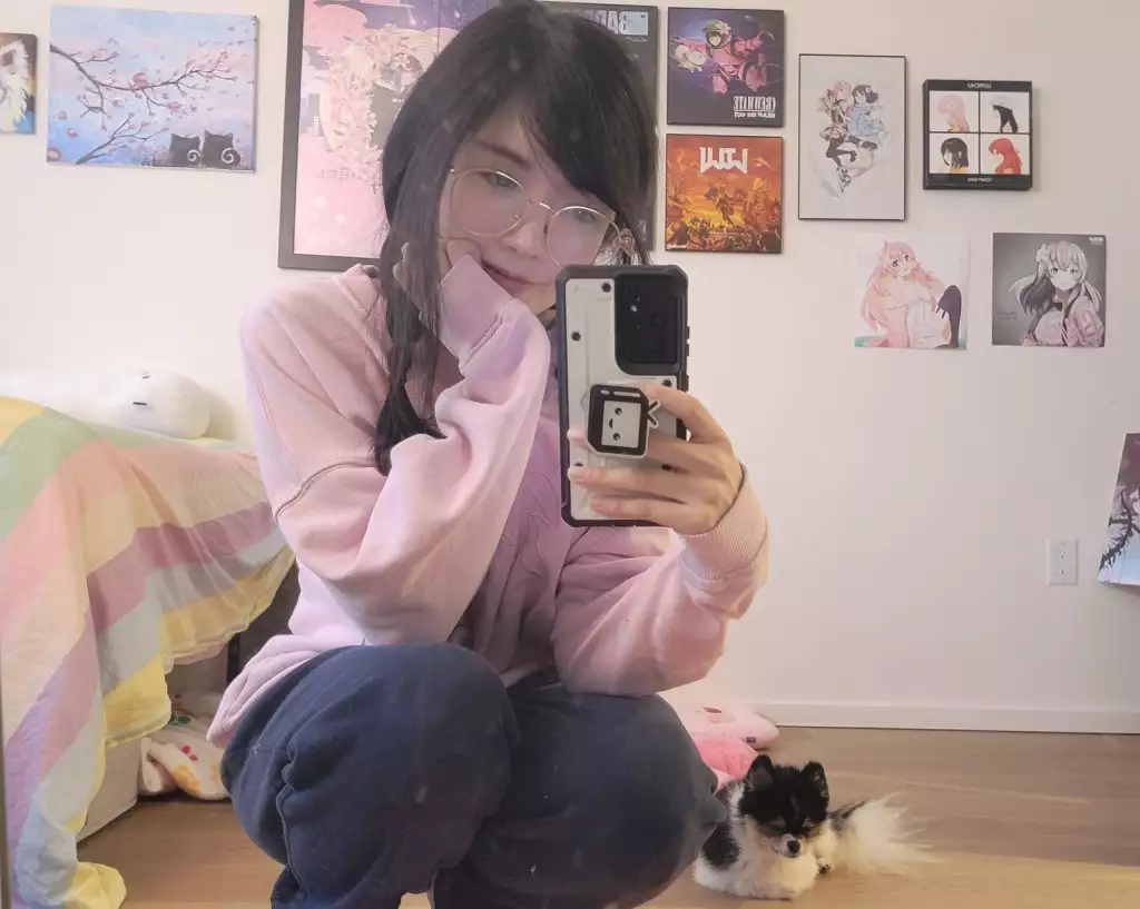 Lily Pichu poses for the camera with DaVinky behind her.