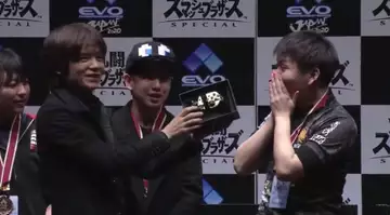 Smash Ultimate’s Sakurai presents EVO Japan winner with Pro Controller - gets dropped instantly
